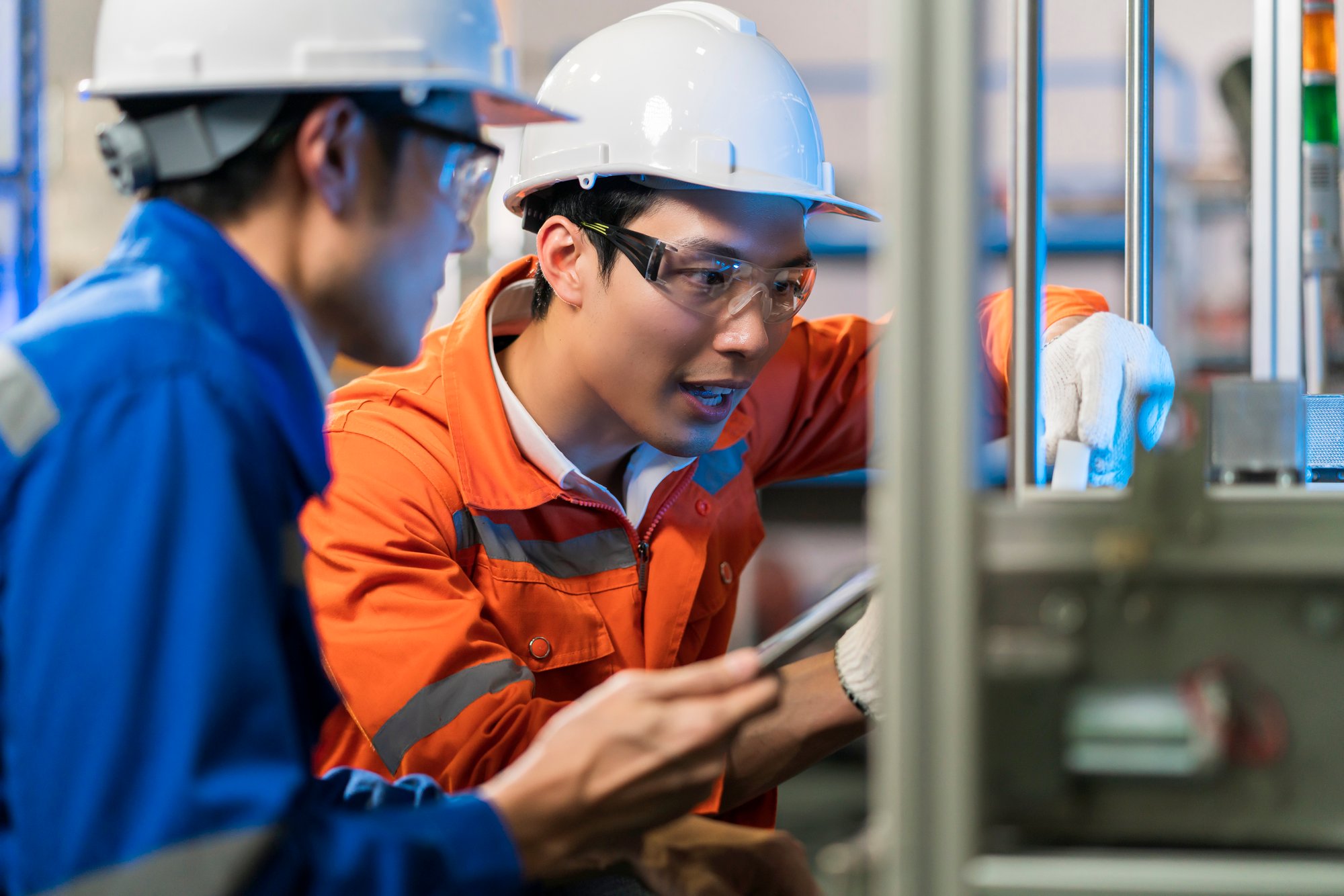 male-asian-engineer-professional-having-discussion-standing-by-machine-factory-two-asian-coworker-brainstorm-explaining-solves-process-curcuit-mother-board-machine